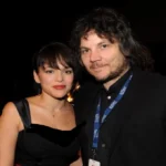 Norah Jones and Pete Remm an event, both smiling warmly for the camera.