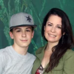 Riley Edward Donoho with his mother, Holly Marie Combs, smiling together at a public event.