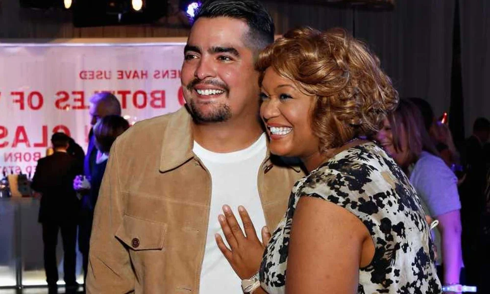 Sunny Anderson Married and Aaron Sanchez sharing a friendly moment at a Food Network event